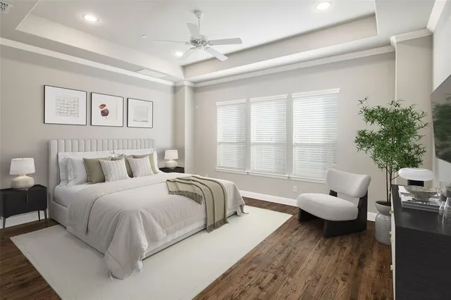 a spacious bedroom with a bed and a couch
