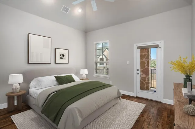 a bedroom with a bed and a painting on the wall