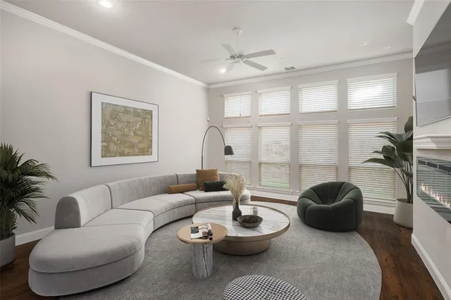 a living room with furniture a rug and a large window