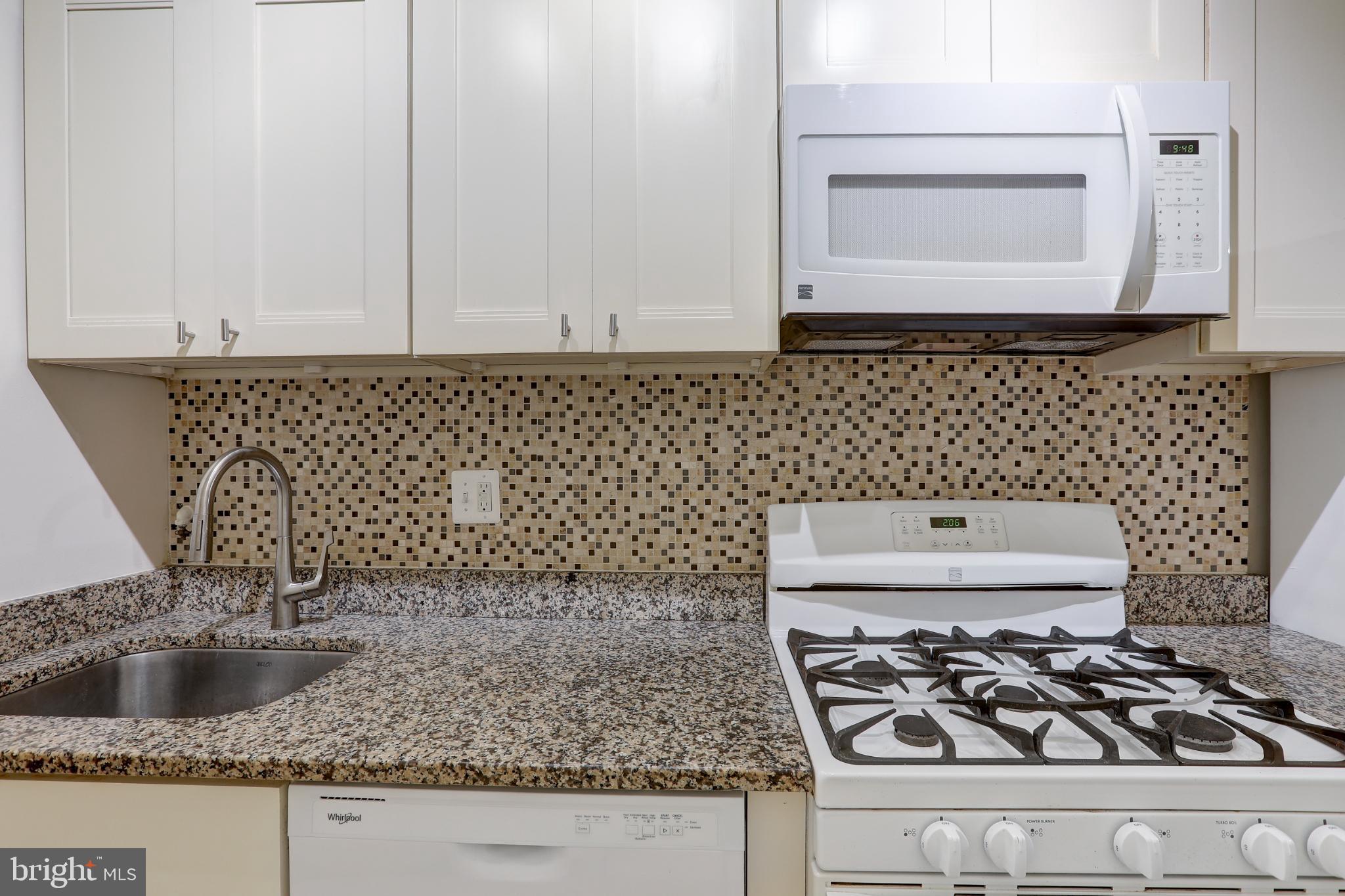 4016 47th Street Northwest, Unit 2 Washington, DC 20016 - Photo 13 of 27 a kitchen with a stove and a sink