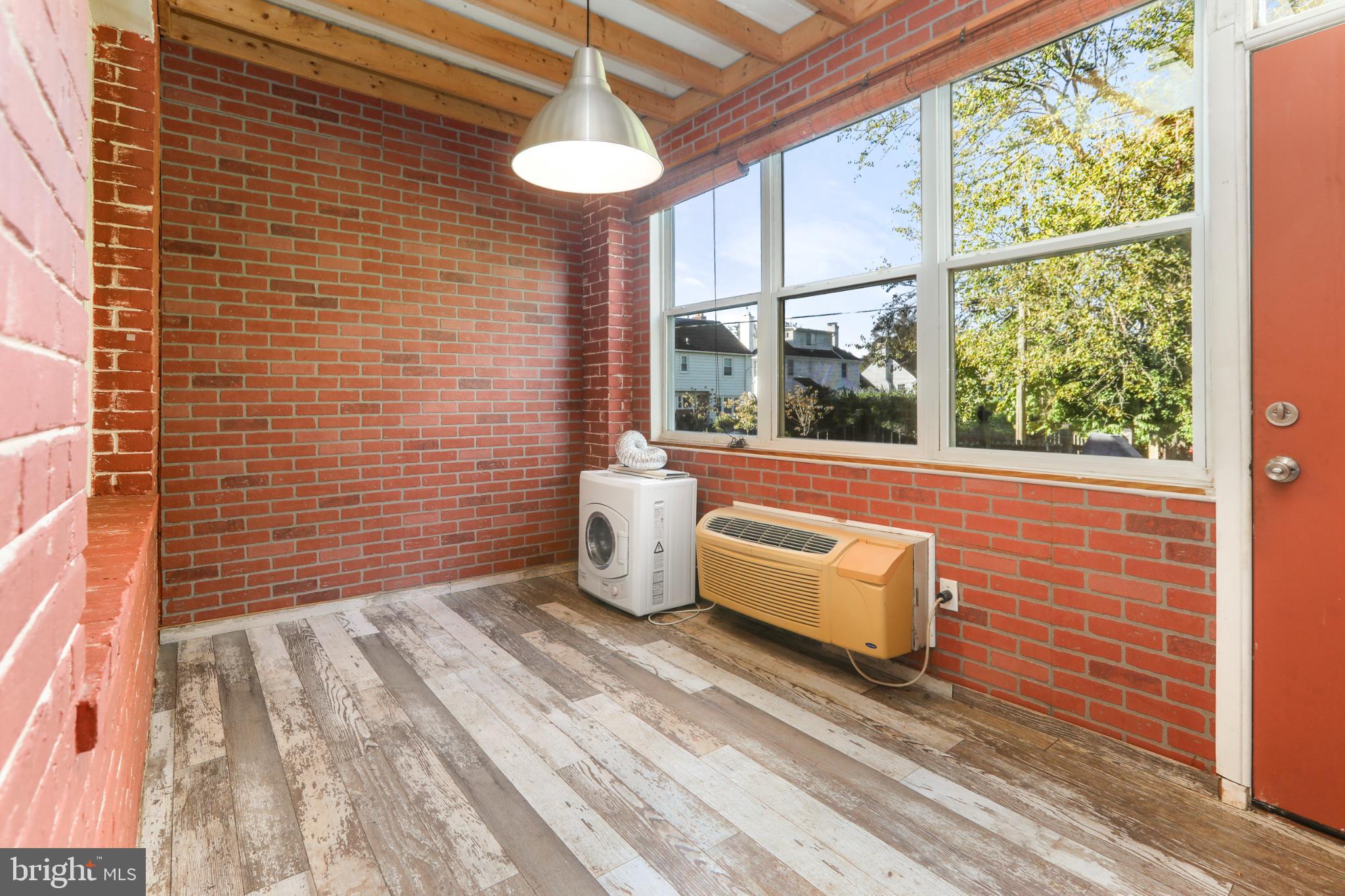 4016 47th Street Northwest, Unit 2 Washington, DC 20016 - Photo 19 of 27 a bathroom with a sink mirror and a bathtub