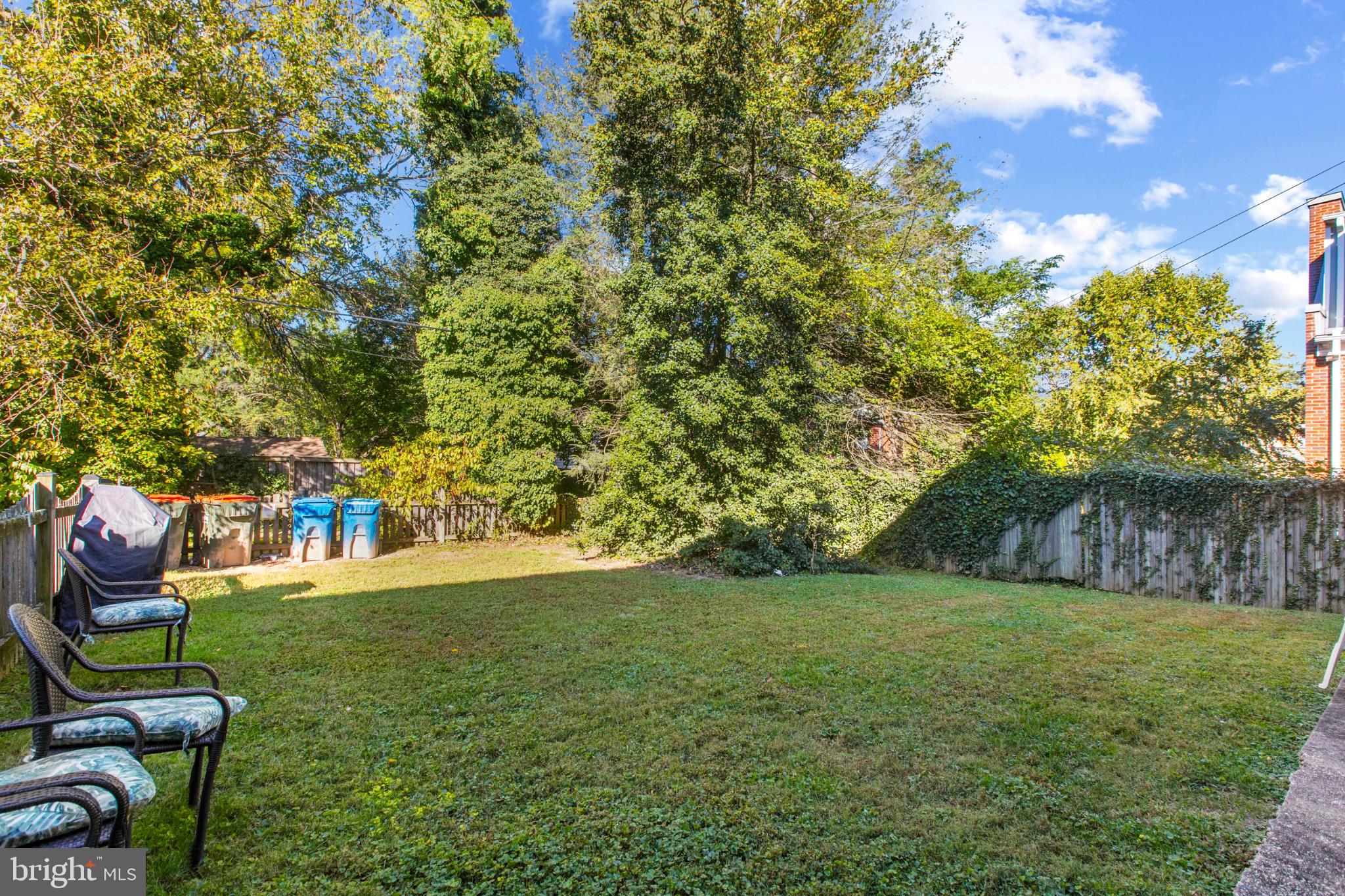 4016 47th Street Northwest, Unit 2 Washington, DC 20016 - Photo 23 of 27 a view of a backyard with table and chairs and potted plants