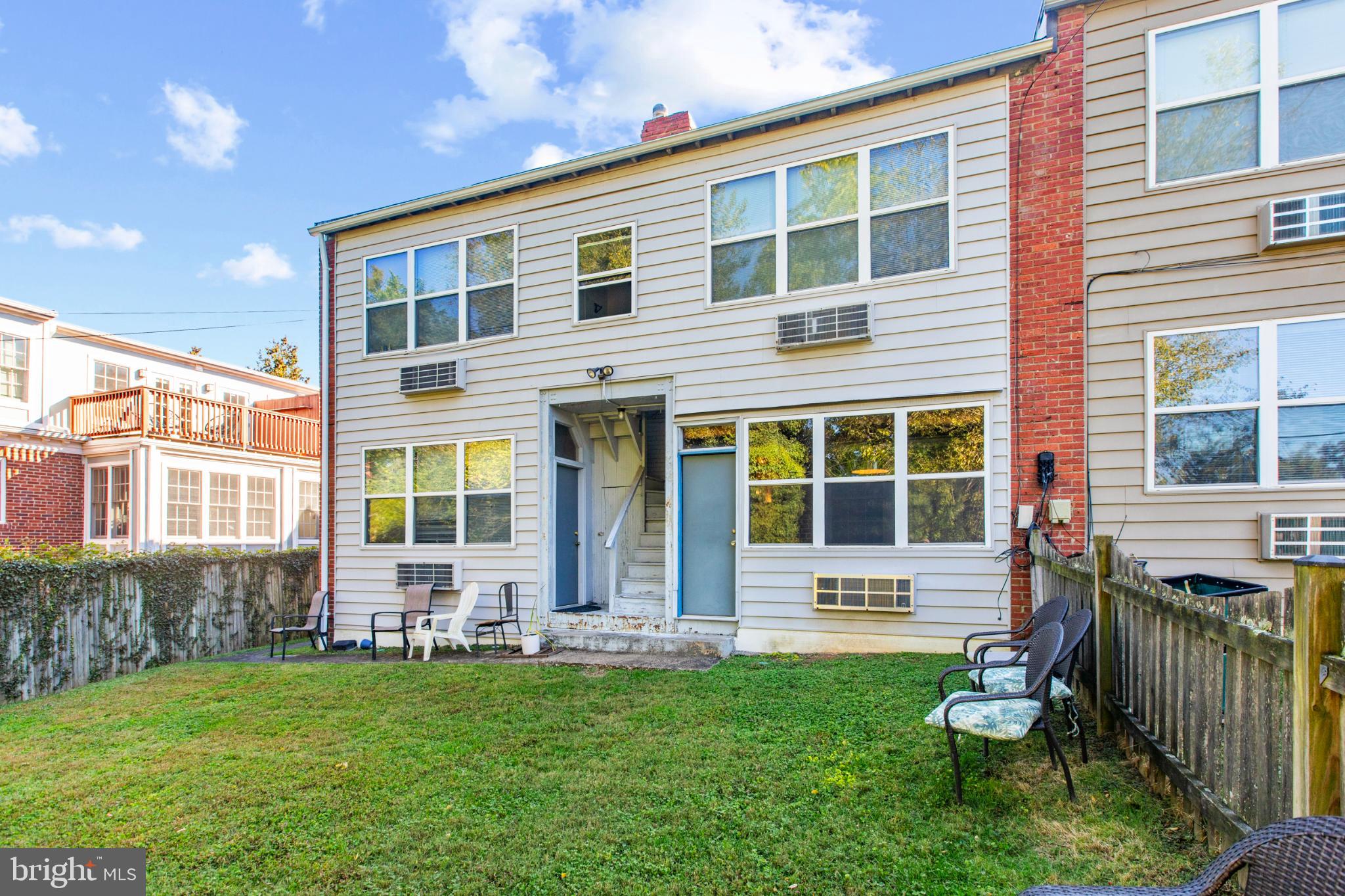 4016 47th Street Northwest, Unit 2 Washington, DC 20016 - Photo 25 of 27 a front view of a house with a yard and outdoor seating