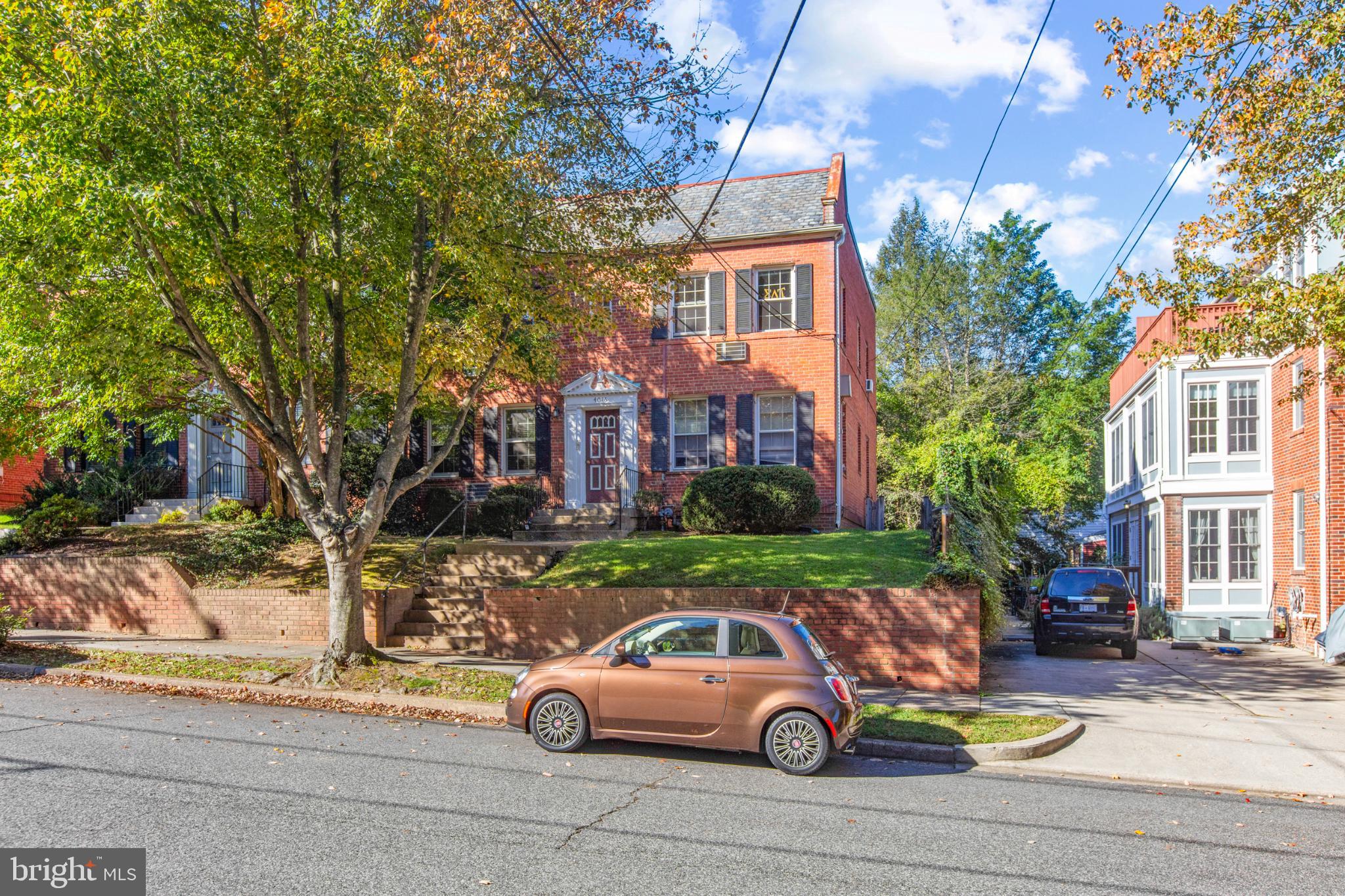 4016 47th Street Northwest, Unit 2 Washington, DC 20016 - Photo 3 of 27 a front view of a house with parking yard