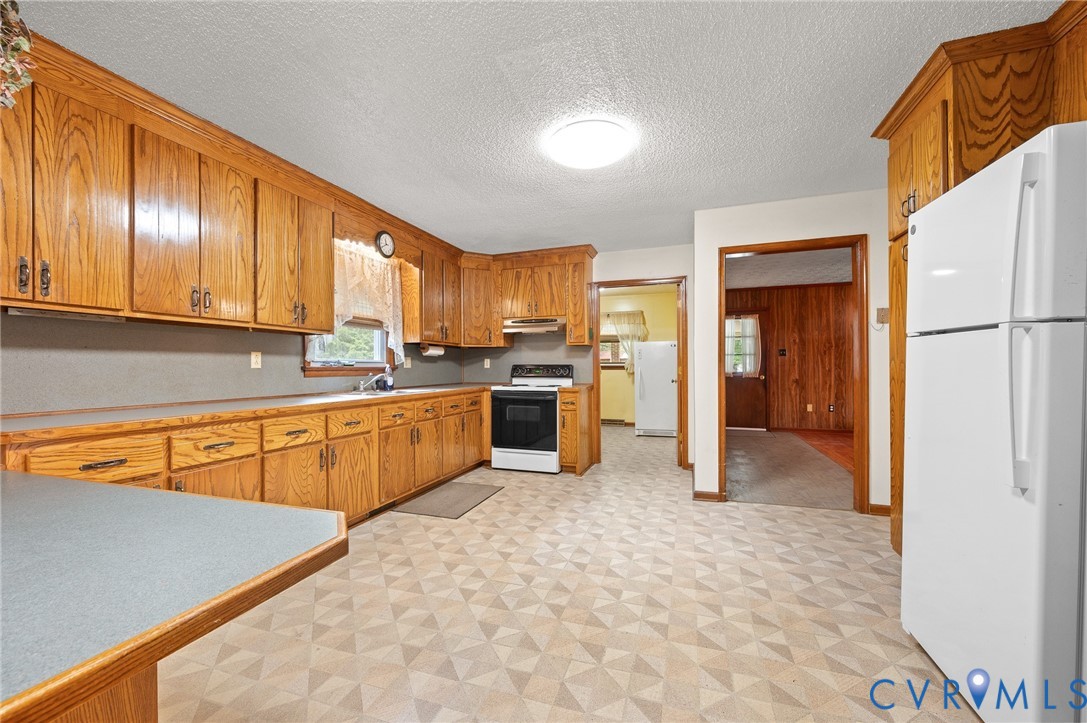 3612 Back Hampden Sydney Road Farmville, VA 23901 - Photo 12 of 17 Kitchen with wood-finish cabinetry, built-in sink,