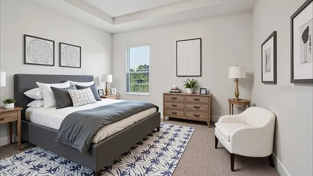 a bedroom with bed and a couch