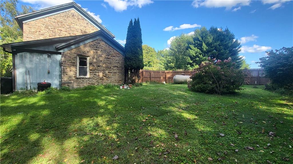 211 West Jamestown Road Jamestown, PA 16134 - Photo 8 of 24 a view of backyard with a garden and plants