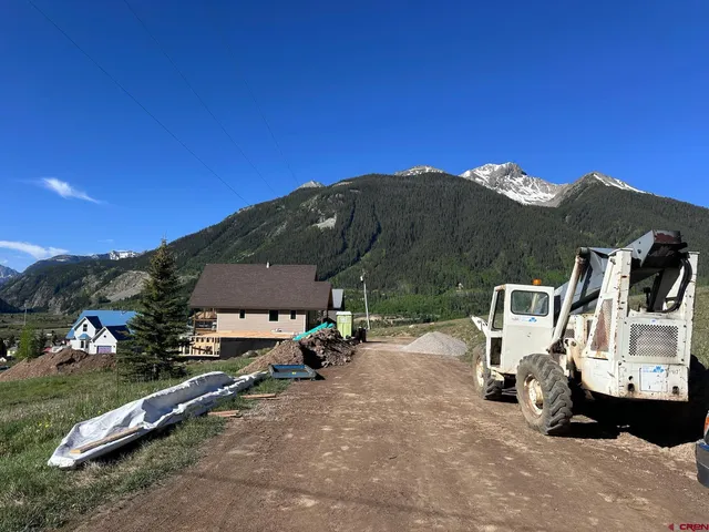 a view of a street with cars
