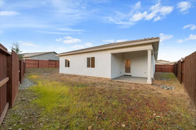 a house view with a backyard space