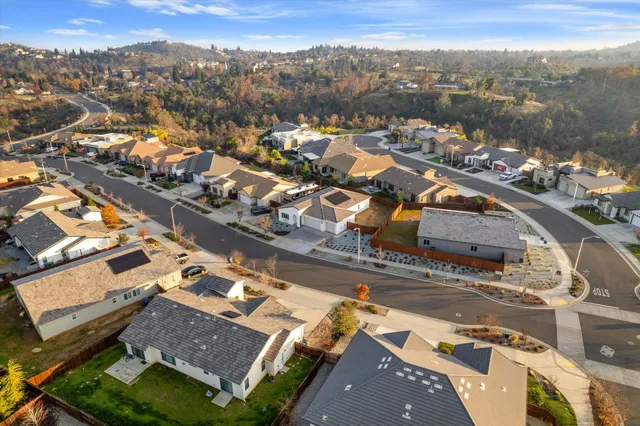 an aerial view of residential building with parking