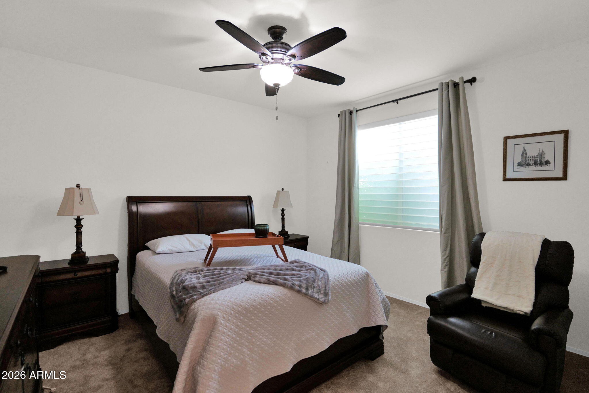 7438 West Noble Prairie Way Florence, AZ 85132 - Photo 12 of 38 a bedroom with a bed and a window