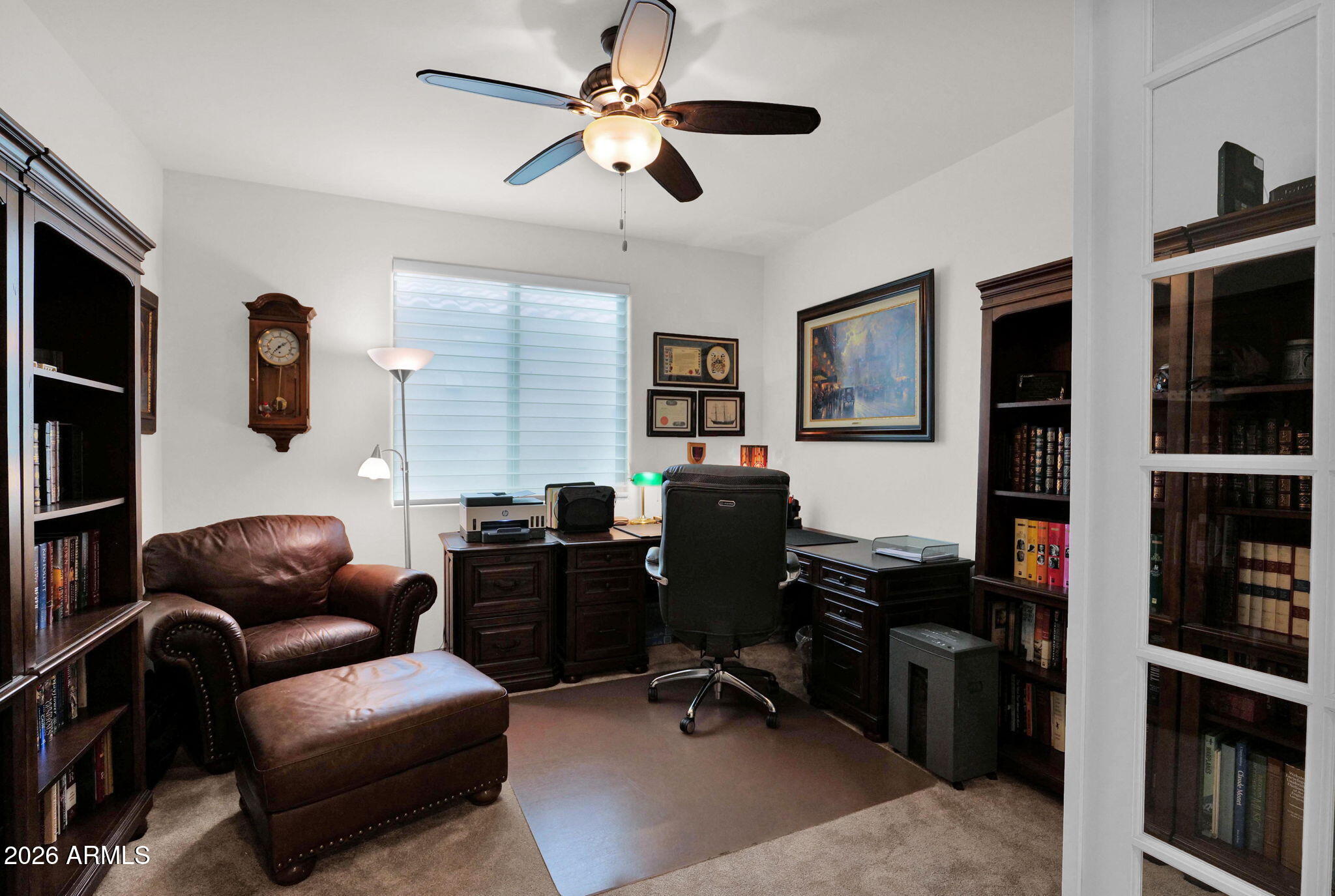 7438 West Noble Prairie Way Florence, AZ 85132 - Photo 14 of 38 a livingroom with workspace couch and a window