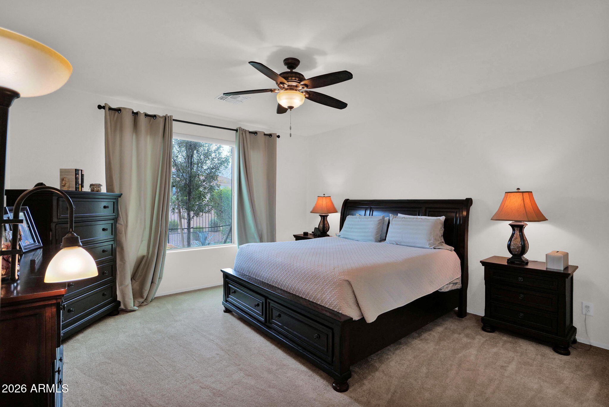 7438 West Noble Prairie Way Florence, AZ 85132 - Photo 15 of 38 a bedroom with a bed and window