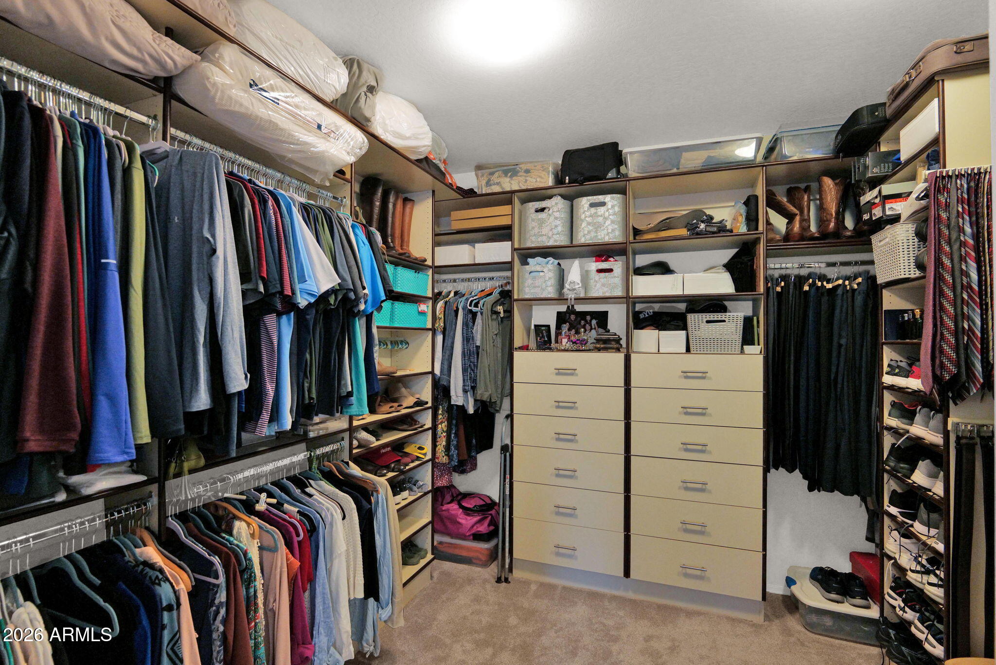 7438 West Noble Prairie Way Florence, AZ 85132 - Photo 20 of 38 a view of walk in closet with clothes