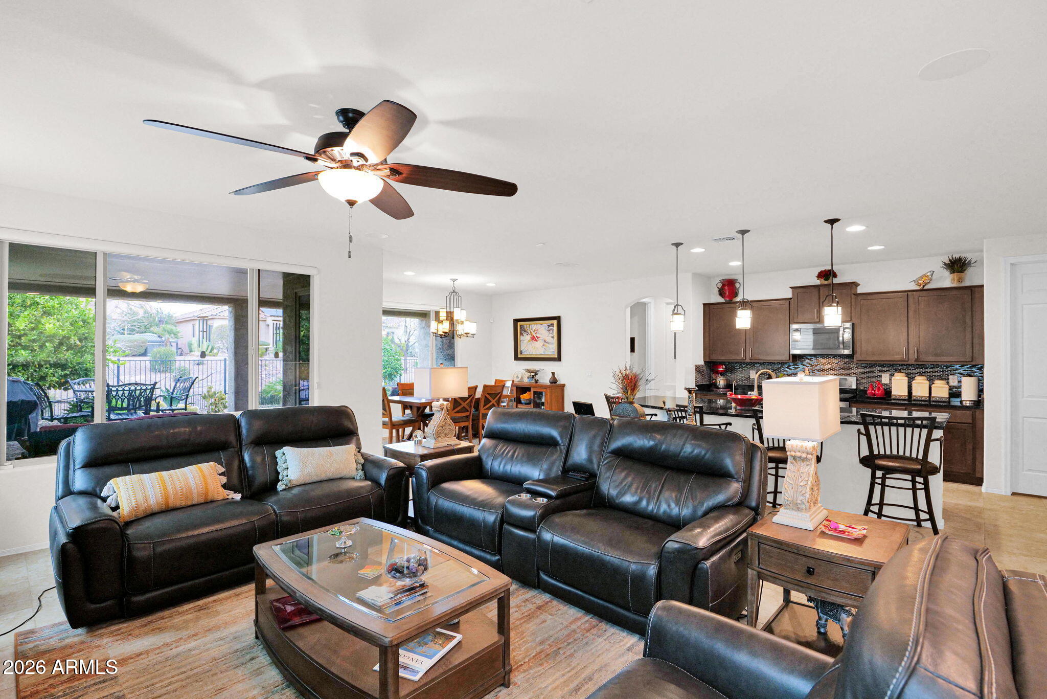 7438 West Noble Prairie Way Florence, AZ 85132 - Photo 30 of 38 a living room with furniture and a large window