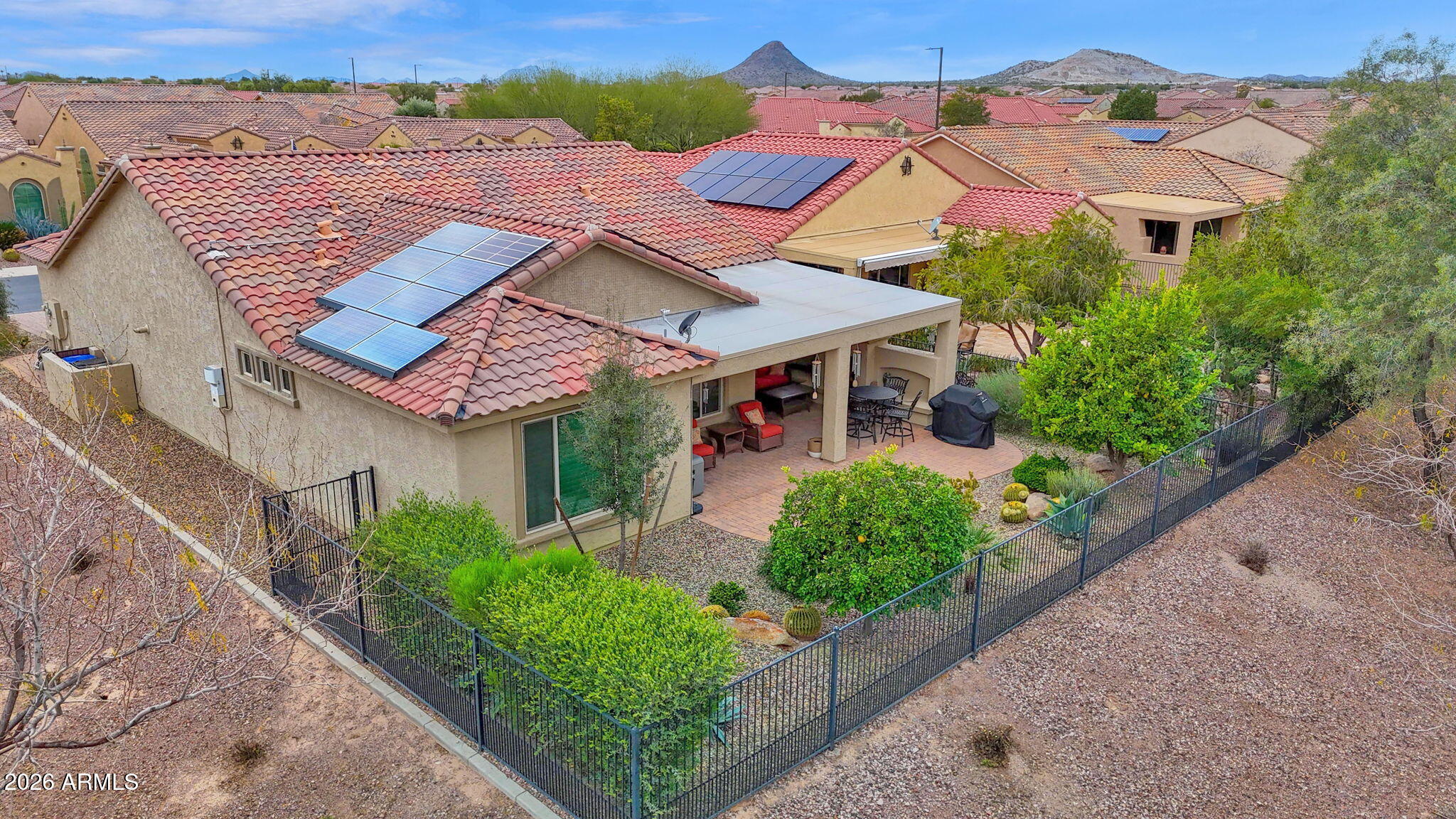 7438 West Noble Prairie Way Florence, AZ 85132 - Photo 3 of 38 an aerial view of a house with a yard and plants