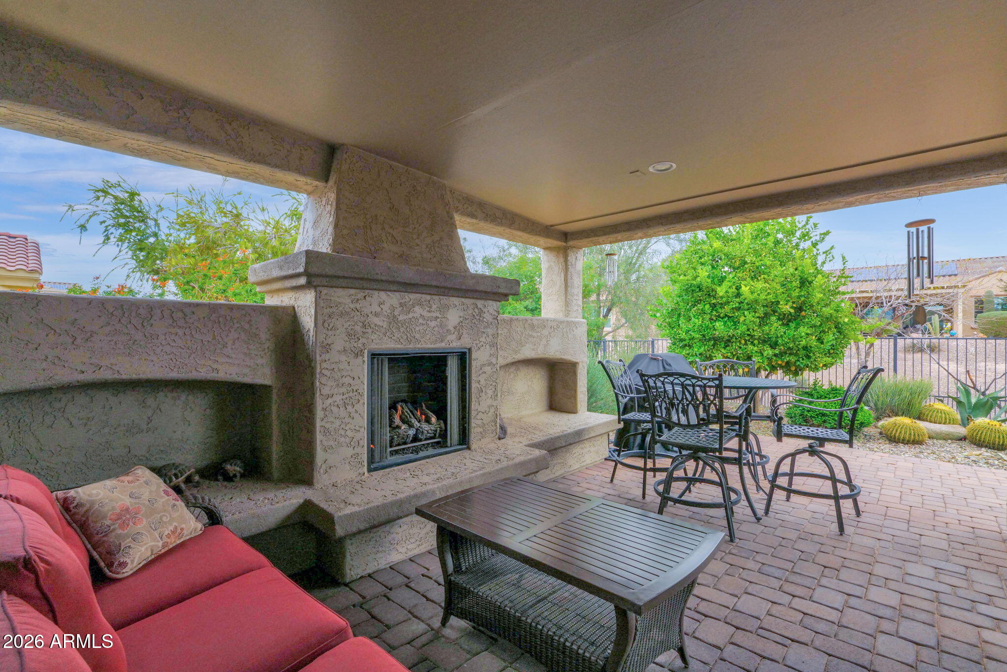 7438 West Noble Prairie Way Florence, AZ 85132 - Photo 32 of 38 a living room with furniture and a fireplace