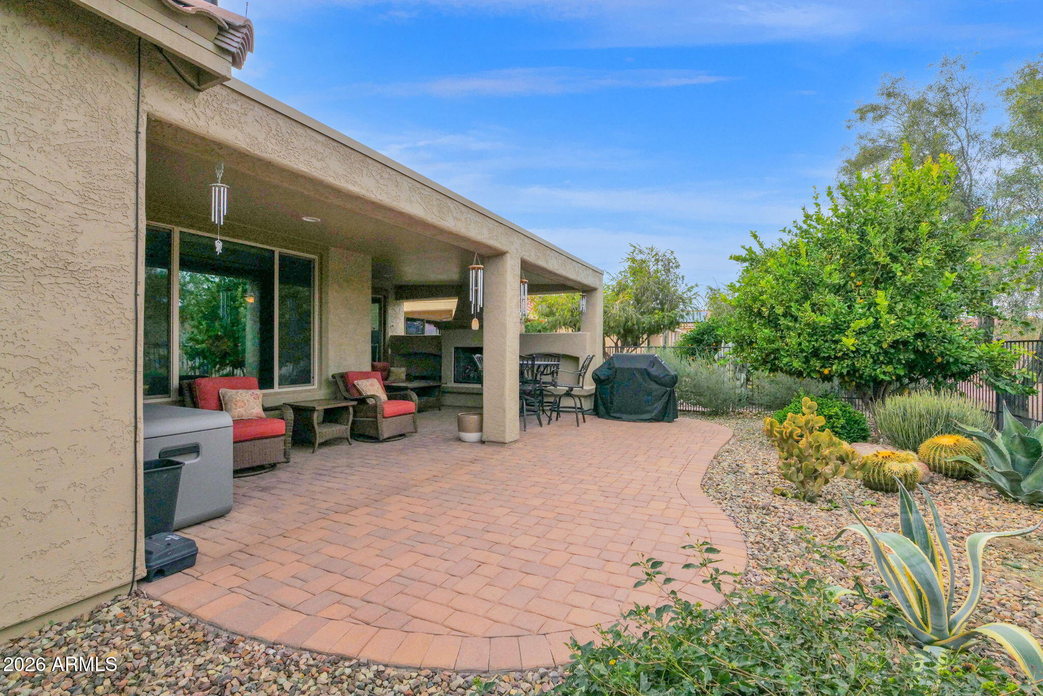 7438 West Noble Prairie Way Florence, AZ 85132 - Photo 36 of 38 a view of a house with backyard and sitting area