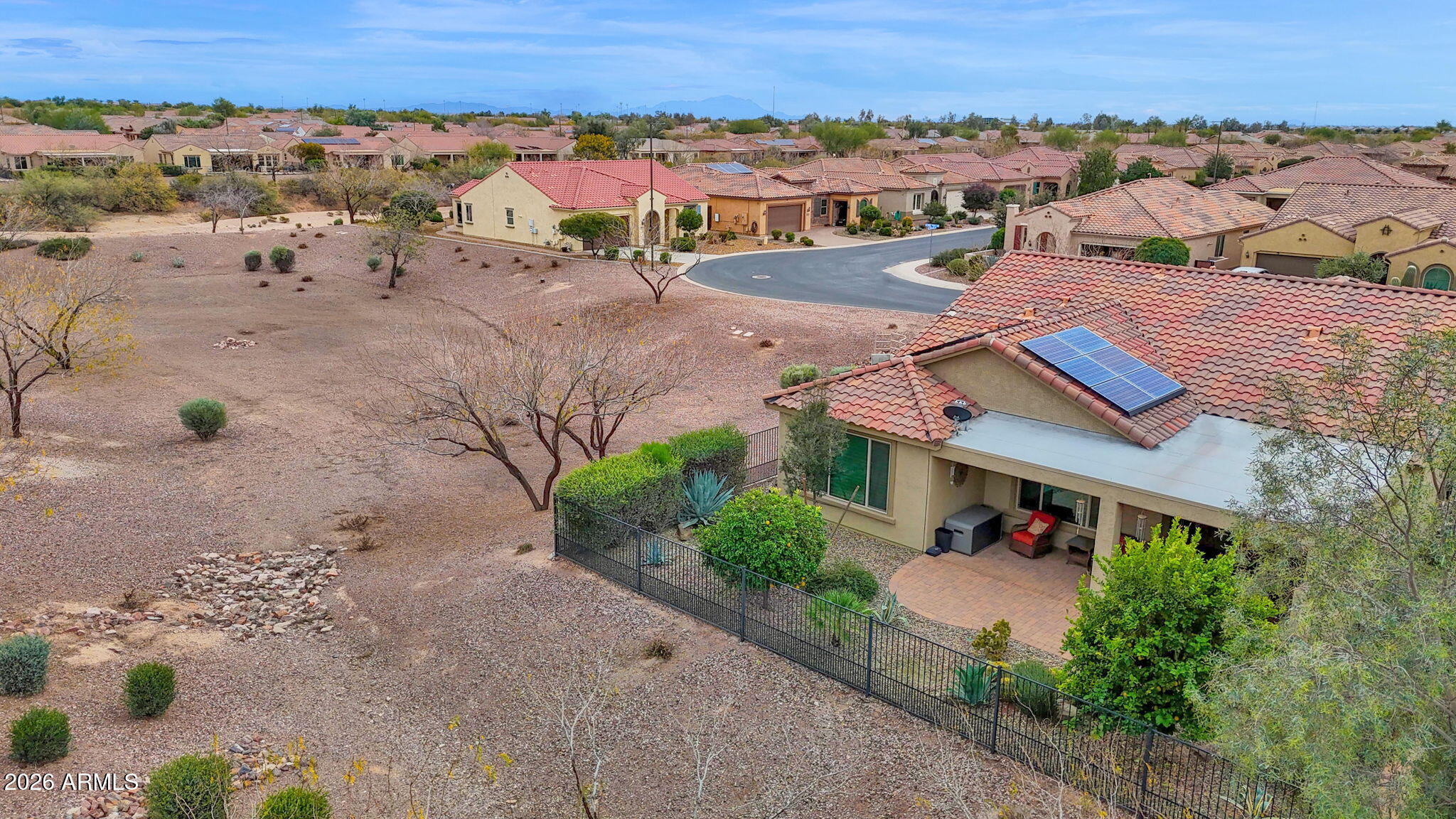 7438 West Noble Prairie Way Florence, AZ 85132 - Photo 4 of 38 an aerial view of multiple houses with a yard
