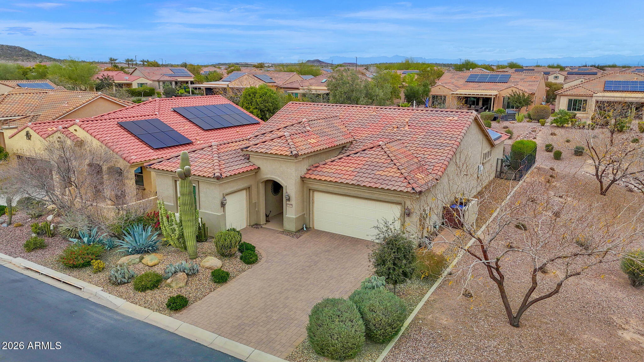 7438 West Noble Prairie Way Florence, AZ 85132 - Photo 7 of 38 an aerial view of multiple houses with a yard