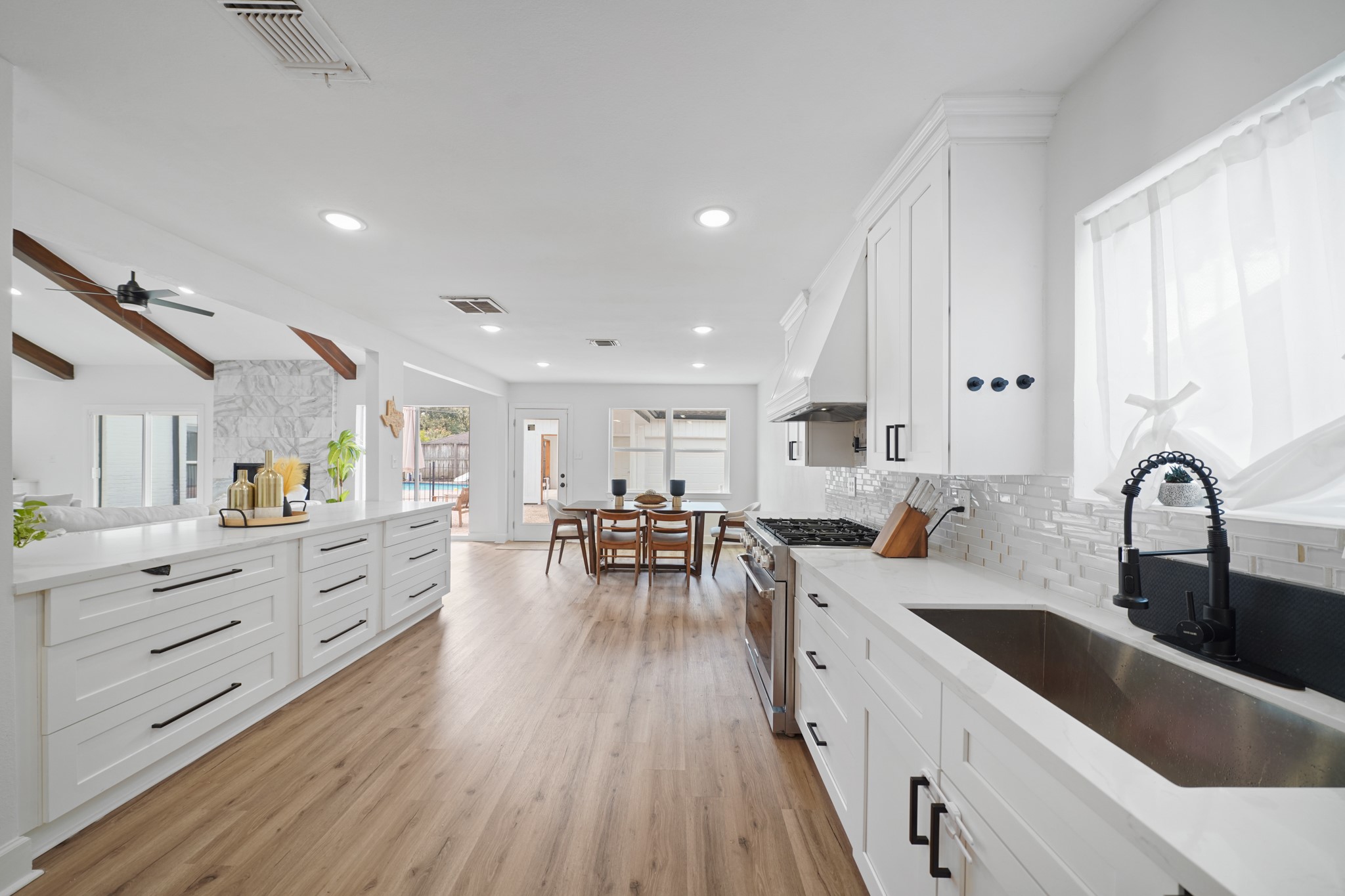 10031 Inwood Drive Houston, TX 77042 - Photo 15 of 31 a large kitchen with stainless steel appliances lots of counter space and a sink