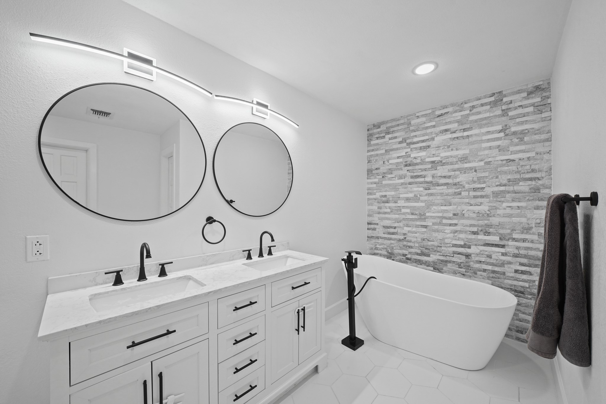 10031 Inwood Drive Houston, TX 77042 - Photo 19 of 31 a bathroom with a double vanity sink mirror and a toilet