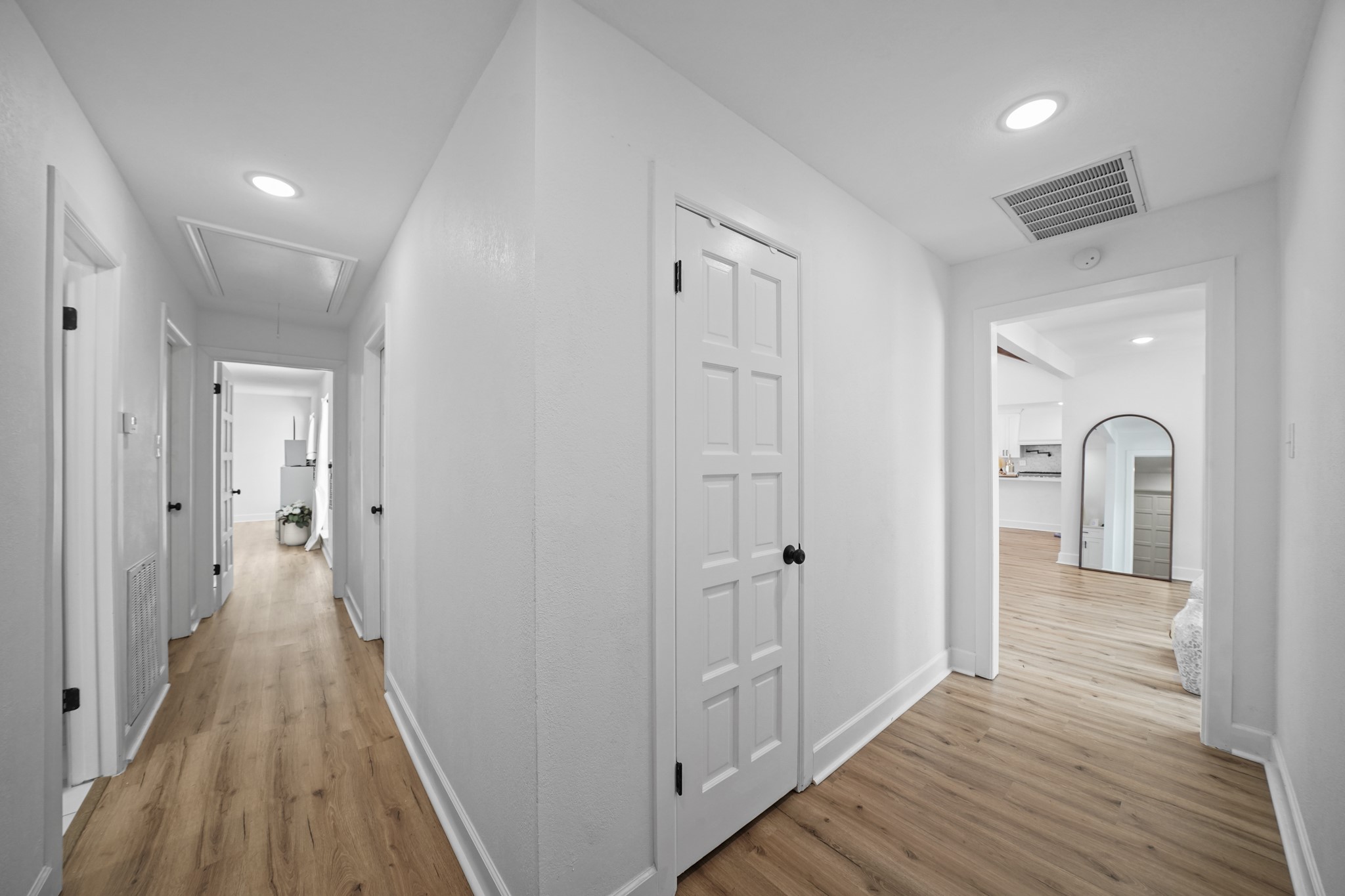 10031 Inwood Drive Houston, TX 77042 - Photo 21 of 31 a view of a hallway with wooden floor