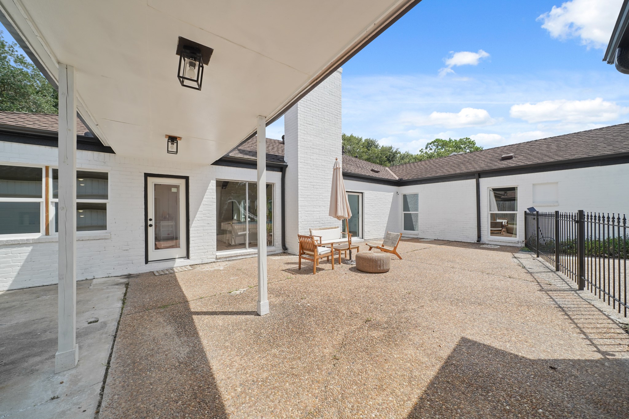 10031 Inwood Drive Houston, TX 77042 - Photo 27 of 31 a view of a house with backyard and sitting area