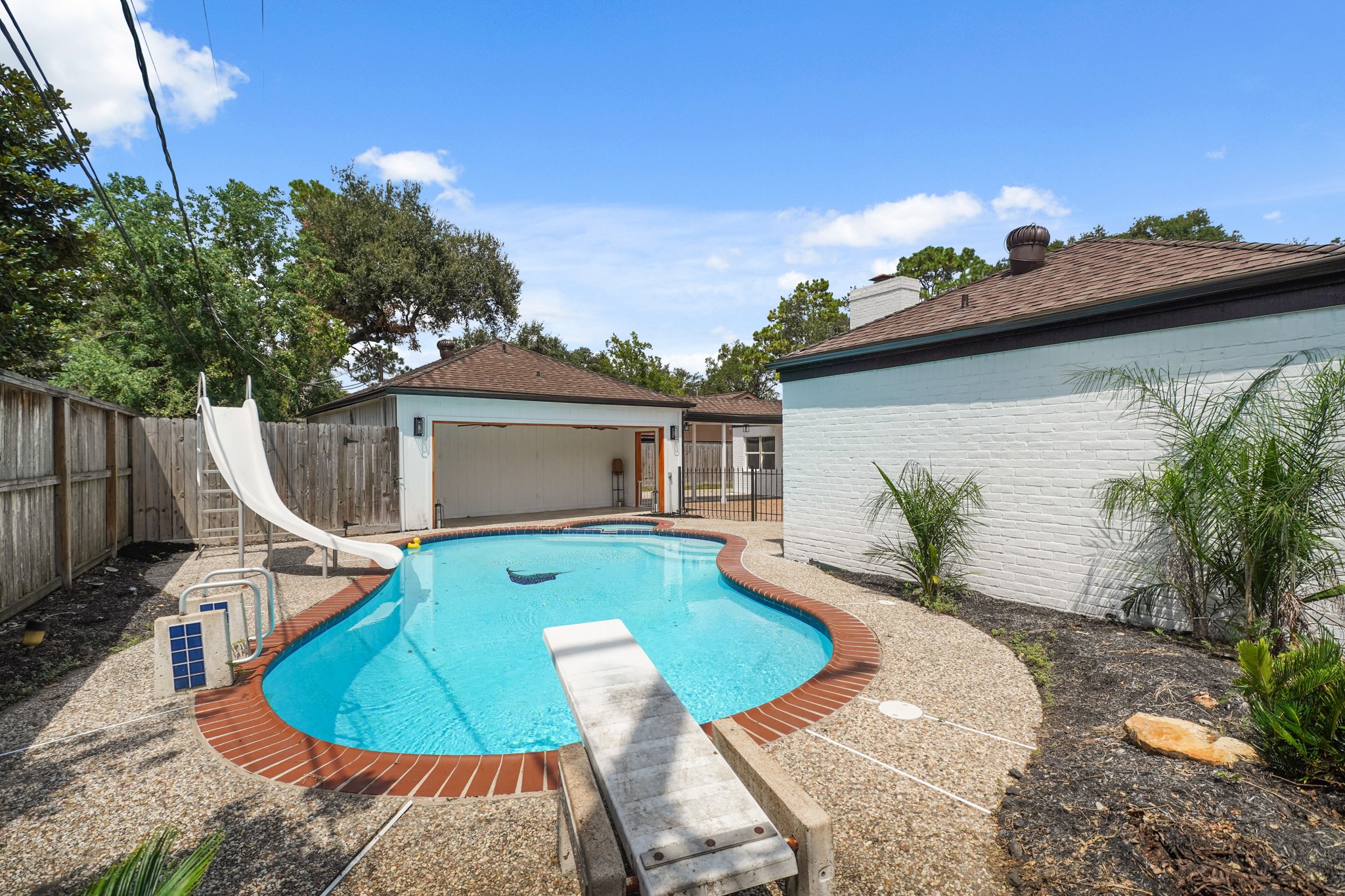 10031 Inwood Drive Houston, TX 77042 - Photo 30 of 31 a view of a house with backyard and sitting area