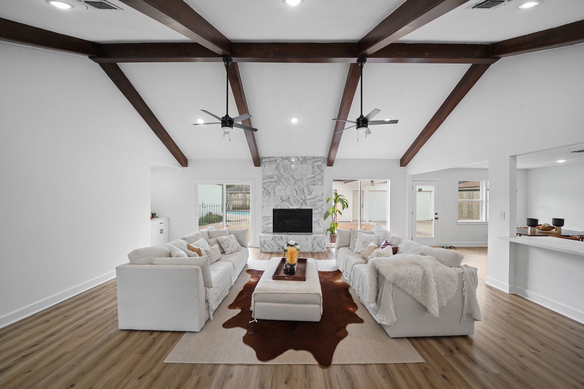 10031 Inwood Drive Houston, TX 77042 - Photo 6 of 31 a living room with furniture fireplace and flat screen tv