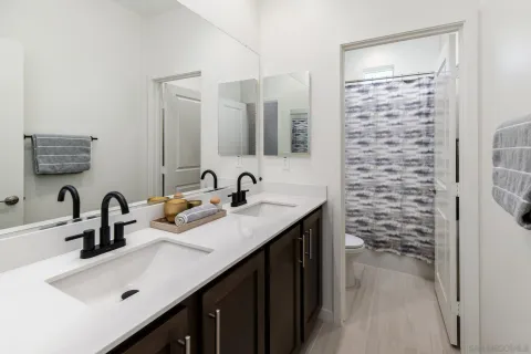 a bathroom with a sink a vanity and a mirror
