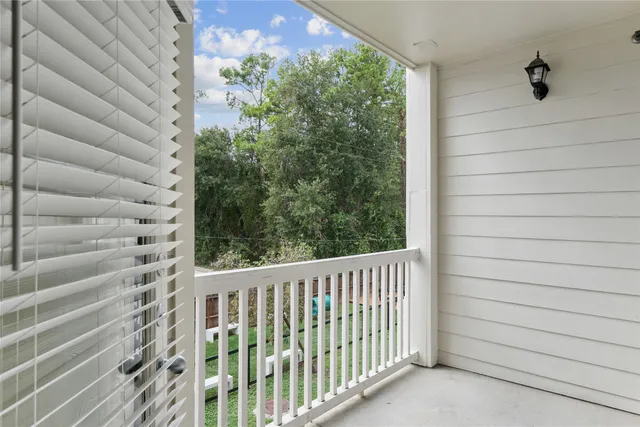 a view of a balcony with a plant