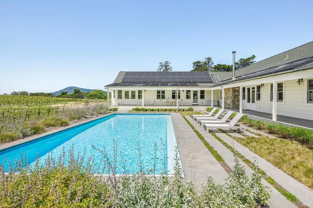a front view of a house with swimming pool