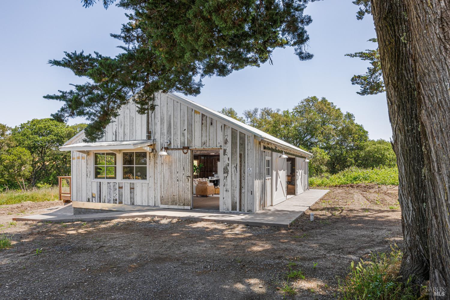 5561 Sonoma Mountain Road Santa Rosa, CA 95404 - Photo 6 of 70 a view of a house with a tree in front of it