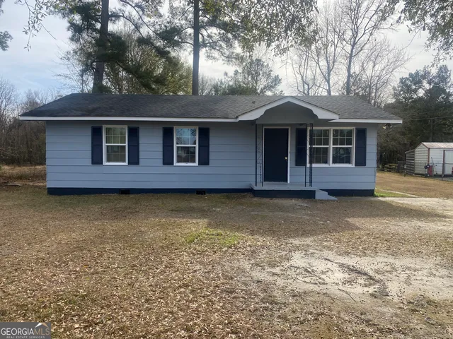 a view of a house with a garden