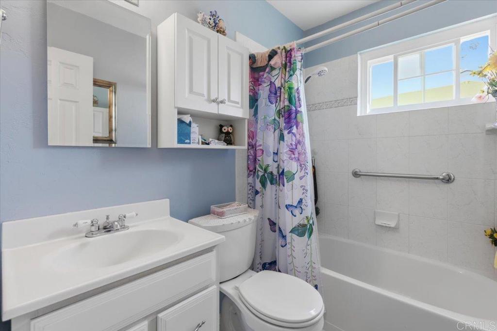 8773 Leigh Avenue Spring Valley, CA 91977 - Photo 17 of 30 a bathroom with a sink toilet and shower