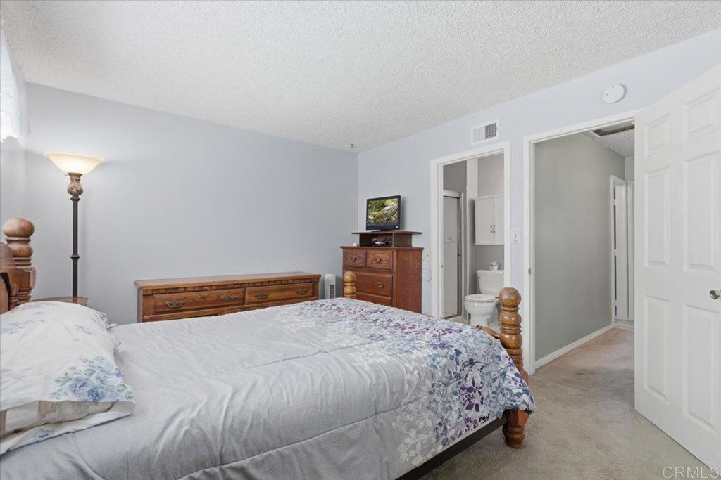 8773 Leigh Avenue Spring Valley, CA 91977 - Photo 18 of 30 a bedroom with a bed and a dresser