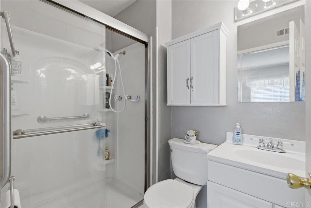 8773 Leigh Avenue Spring Valley, CA 91977 - Photo 21 of 30 a bathroom with a toilet sink and shower