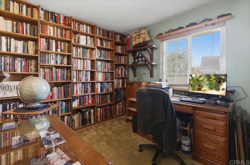 8773 Leigh Avenue Spring Valley, CA 91977 - Photo 22 of 30 a work room with furniture and a book shelf