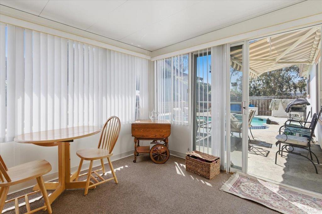 8773 Leigh Avenue Spring Valley, CA 91977 - Photo 24 of 30 a view of a workspace with furniture and a window