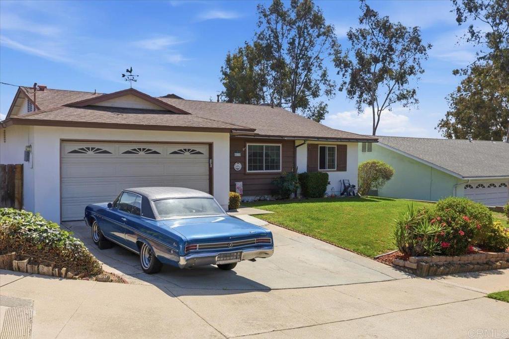8773 Leigh Avenue Spring Valley, CA 91977 - Photo 4 of 30 a front view of a house with garden