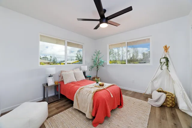 a bed room with a bed and a window