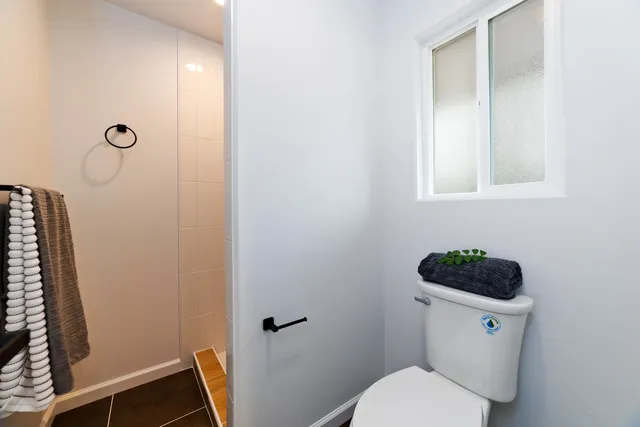 a bathroom with a toilet and a sink