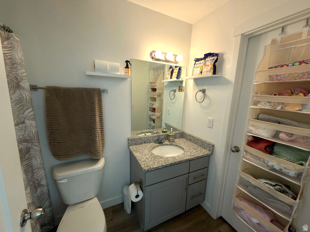 327 West Main Street, Unit 14 Santaquin, UT 84655 - Photo 20 of 20 Full bathroom featuring vanity, dark wood-type flooring, curtained shower, and a closet