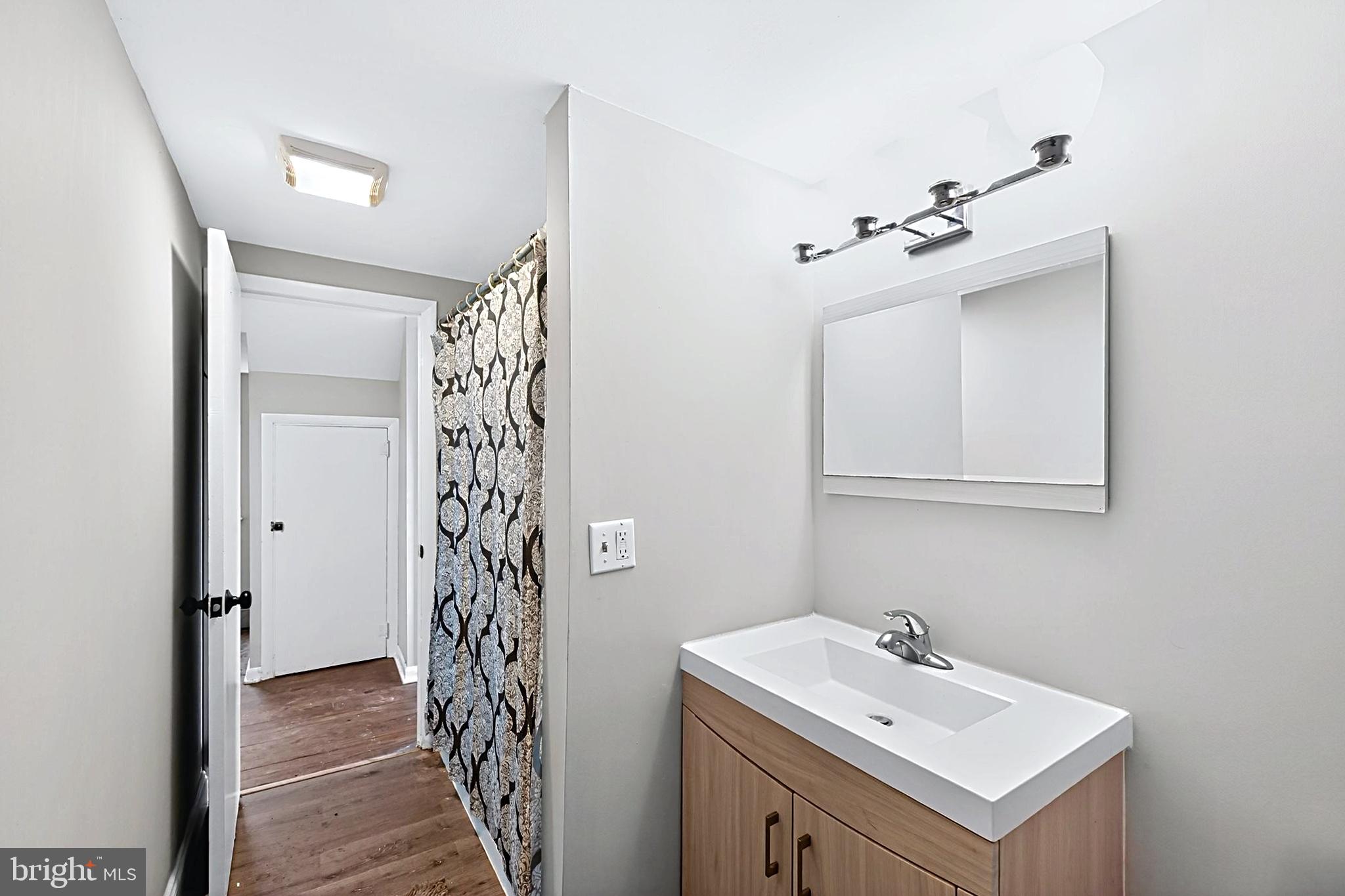 35 West Main Street Salunga, PA 17538 - Photo 3 of 14 Modern hallway with sleek vanity.