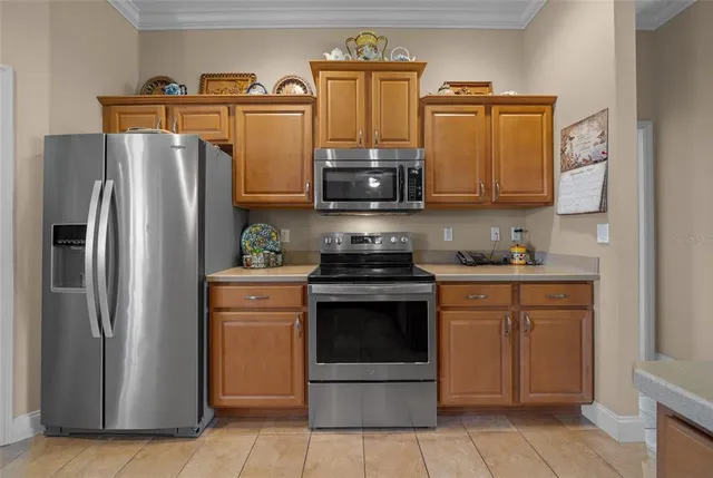 a dining room with furniture a chandelier and a rug