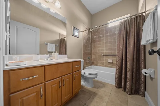 a bedroom with bed and a chandelier