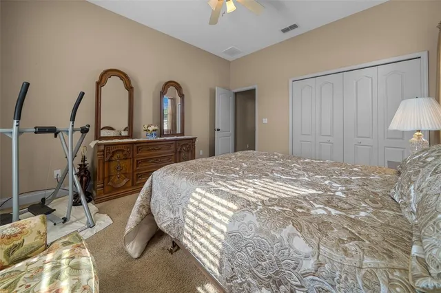 a bathroom with a sink vanity granite tub and a mirror