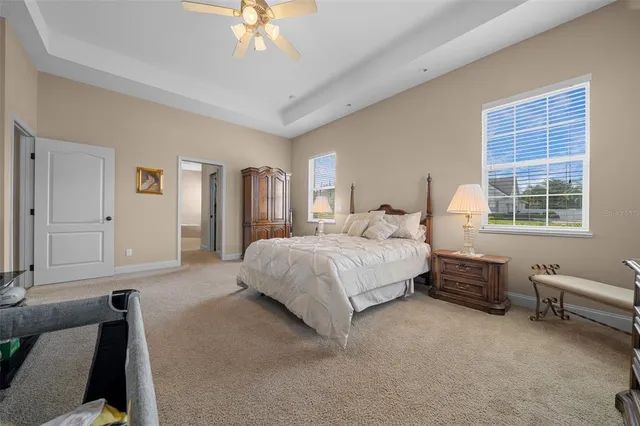 a aerial view of a house next to a yard