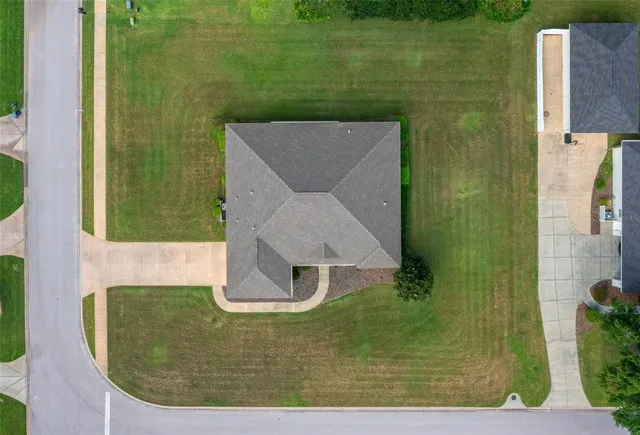 a view of a swimming pool with a yard